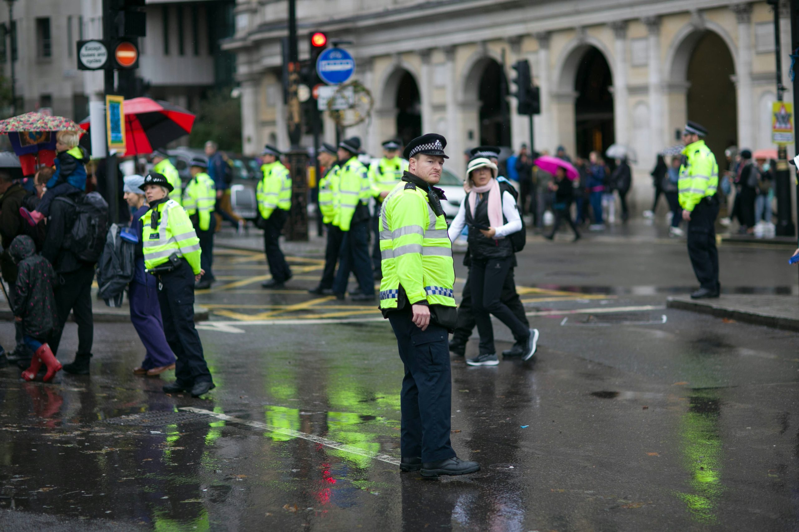 People and police walking in the street